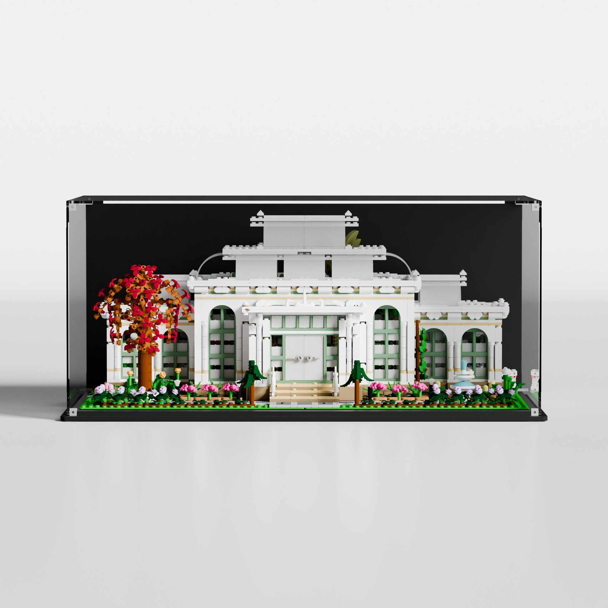 LEGO Ideas The Botanical Garden (21353) in premium UV-protected acrylic display case with glossy black background, EU-made