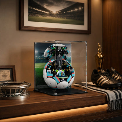 LEGO display case for Soccer Ball 43019 — premium UV-protected acrylic with Stadium background, shown on a shelf with football memorabilia