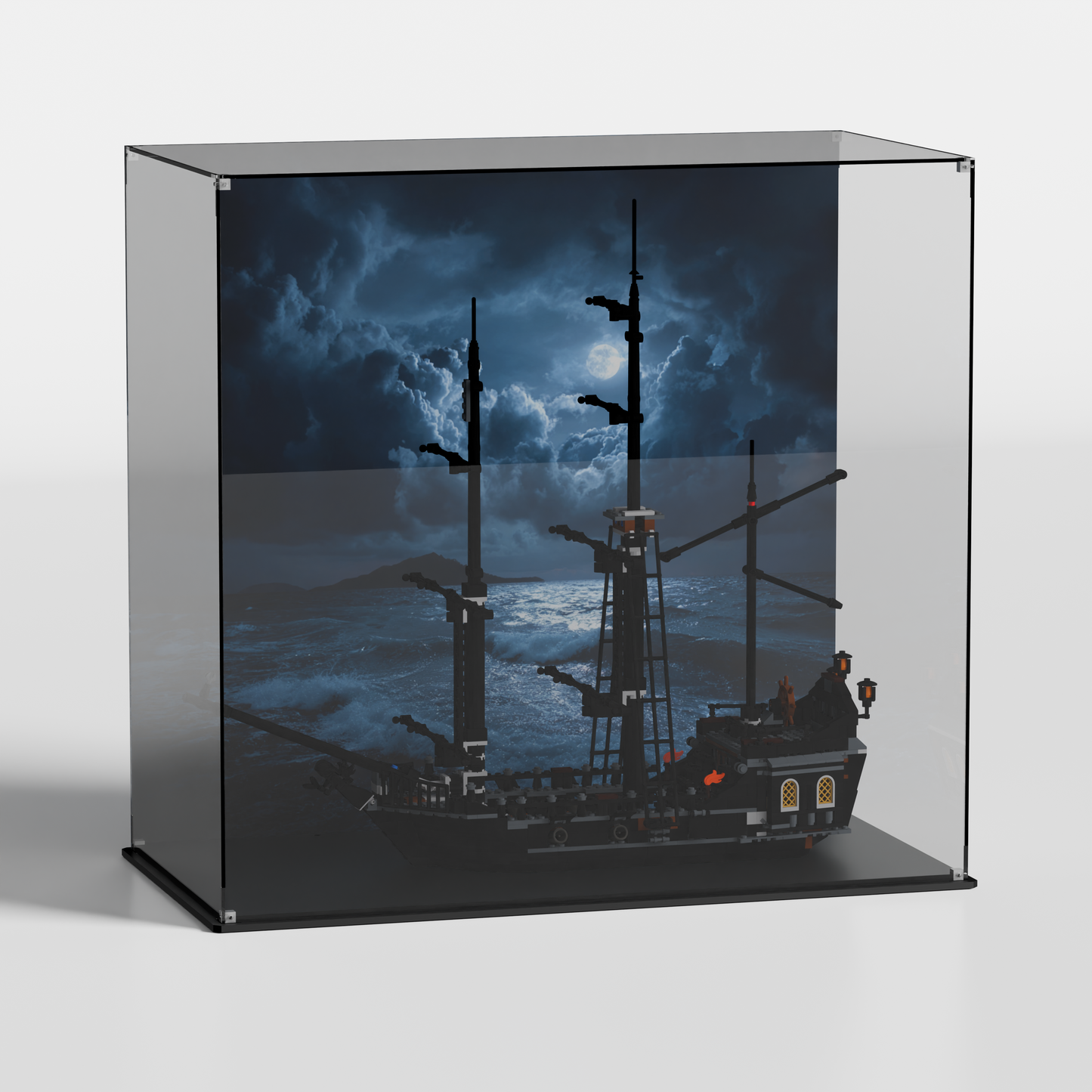 side view of LEGO The Black Pearl 4184 inside premium LEGO display case with moonlit storm-sea background