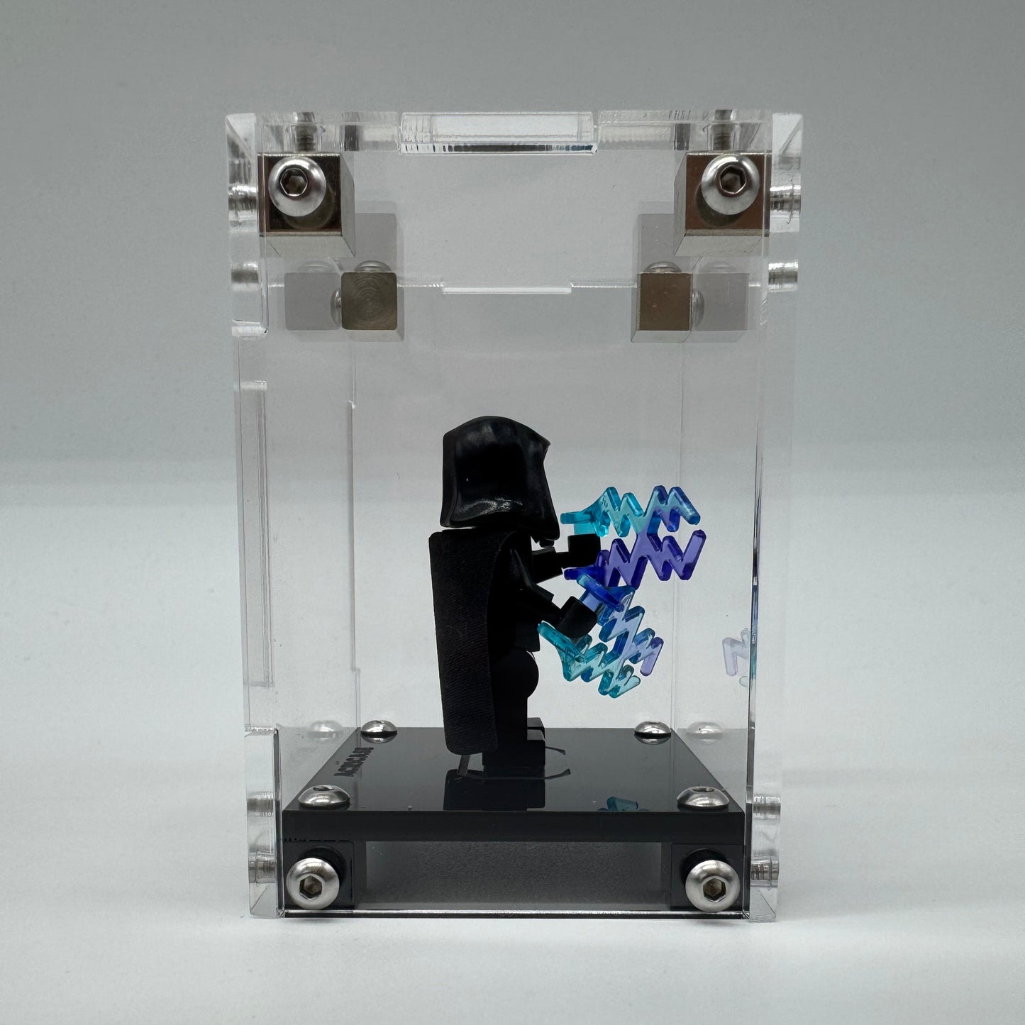 Premium acrylic display case revealing the minifigure's detailed features from the side